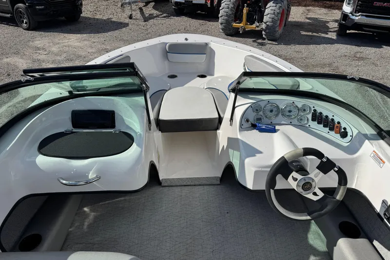 Slide: The Image of 2017 Caravelle 19 EBo Bowrider interior with steering wheel and dashboard controls. - 4