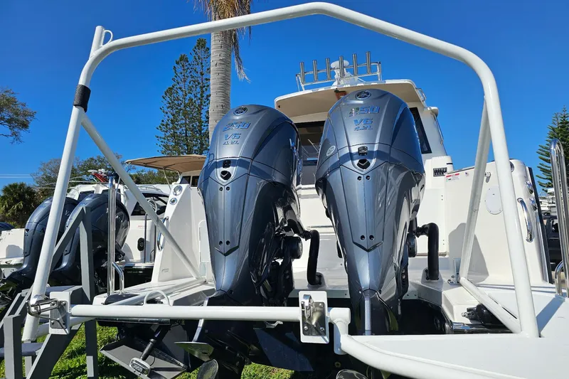 Slide: The Image of 2026 Cutwater C-288 Coupe with dual outboard engines, displayed outdoors. - 4