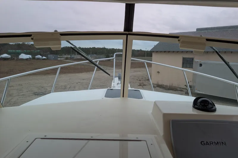 Slide: The Image of 2008 Parker 2510 XL Walkaround boat interior view with Garmin navigation system. - 11
