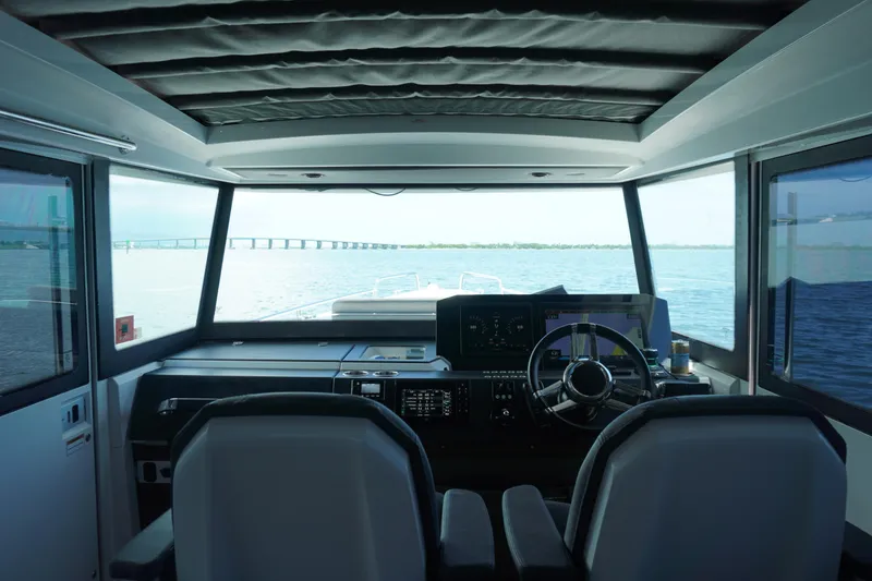 Slide: The Image of Interior view of 2020 Axopar 37 XC Cross Cabin boat cockpit with panoramic windows. - 16