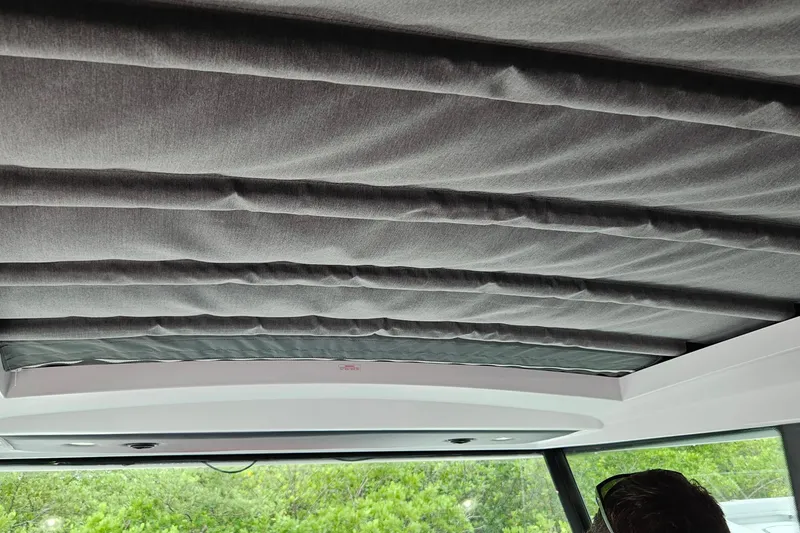 Slide: The Image of Interior ceiling of 2020 Axopar 37 XC Cross Cabin with gray fabric panels. - 6