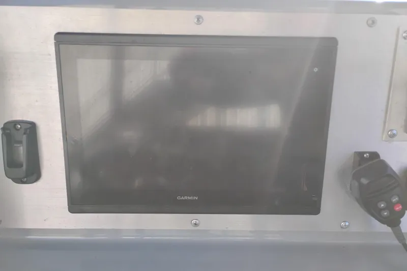 Slide: The Image of Control panel of a 2008 Valiant PT-750 with Garmin display and microphone. - 14