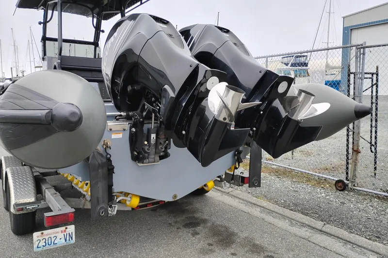 Slide: The Image of Valiant PT-750 boat with dual outboard motors on a trailer, 2008 model. - 2