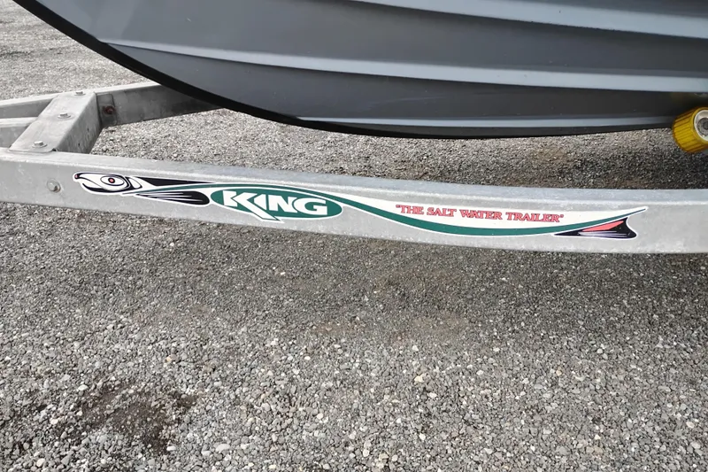 Slide: The Image of Trailer with "King" logo and "The Salt Water Trailer" text on gravel surface. - 26