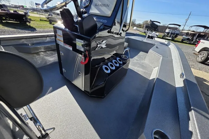 Slide: The Image of 2026 Xpress H24B Bay boat interior with steering console and cup holders. - 12