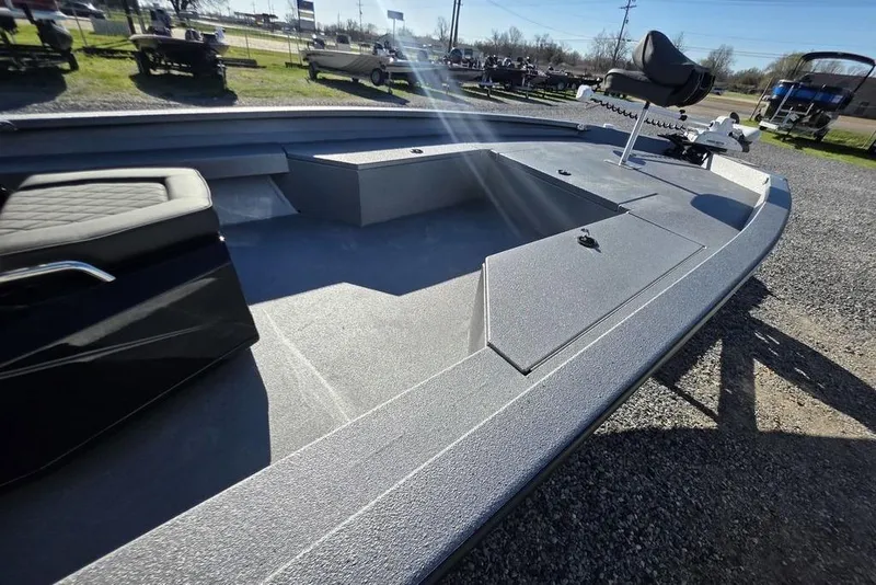 Slide: The Image of 2026 Xpress H24B Bay boat interior with seating and storage compartments. - 13