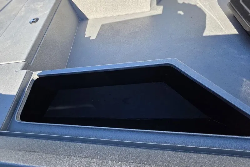 Slide: The Image of 2026 Xpress H24B Bay boat interior storage compartment, sleek and spacious design. - 21