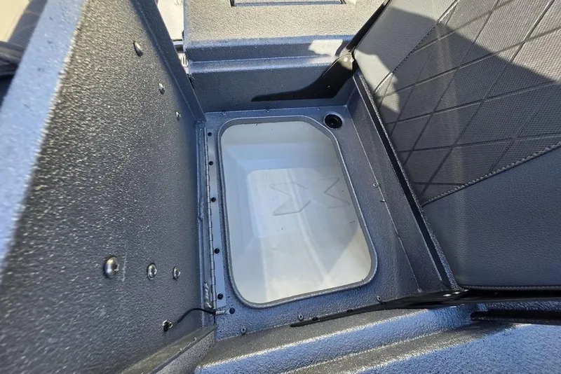 Slide: The Image of Interior view of 2026 Xpress H24B Bay boat storage compartment. - 24