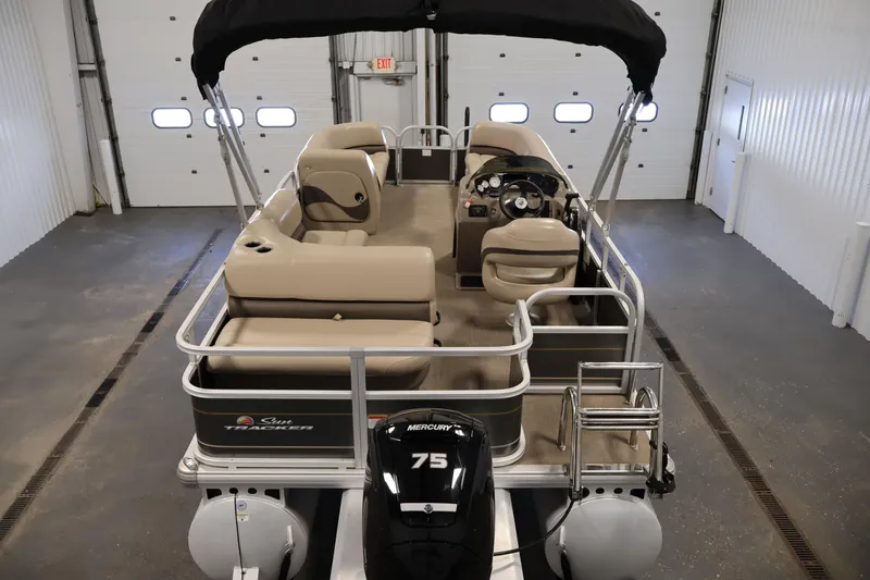 Slide: The Image of 2023 Sun Tracker Party Barge 18 DLX pontoon boat in indoor storage. - 10