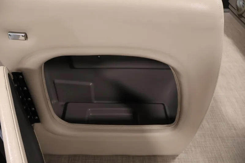 Slide: The Image of 2023 Sun Tracker Party Barge 18 DLX storage compartment with beige interior. - 12