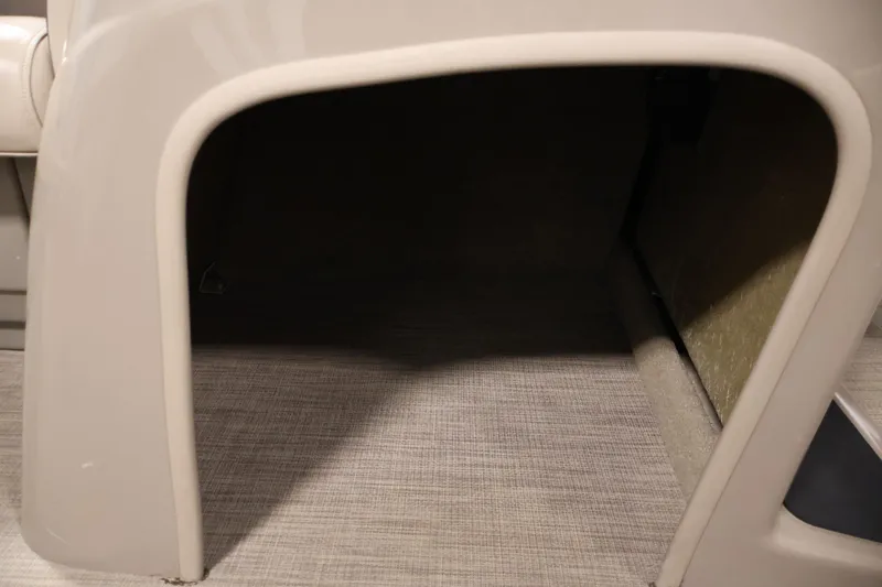 Slide: The Image of 2023 Sun Tracker Party Barge 18 DLX storage compartment interior view. - 19