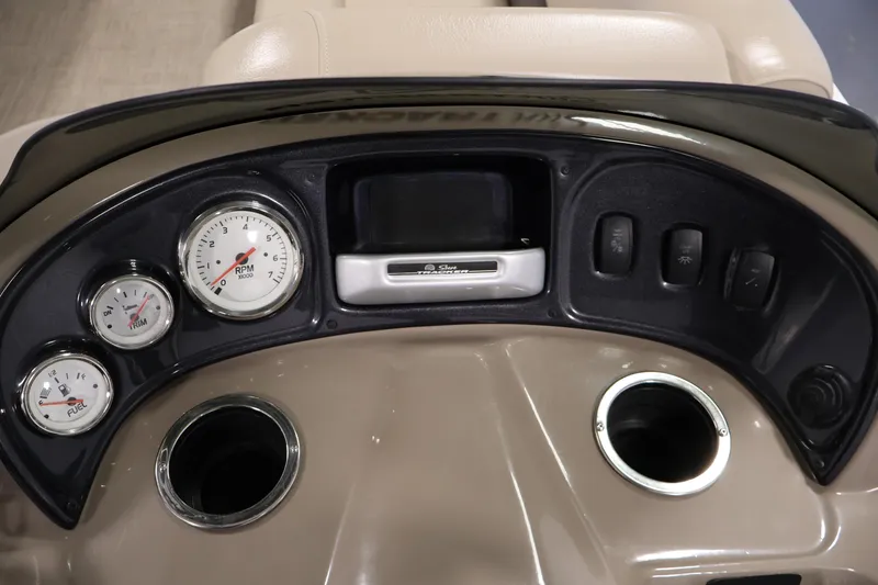 Slide: The Image of 2023 Sun Tracker Party Barge 18 DLX dashboard with gauges and controls. - 22
