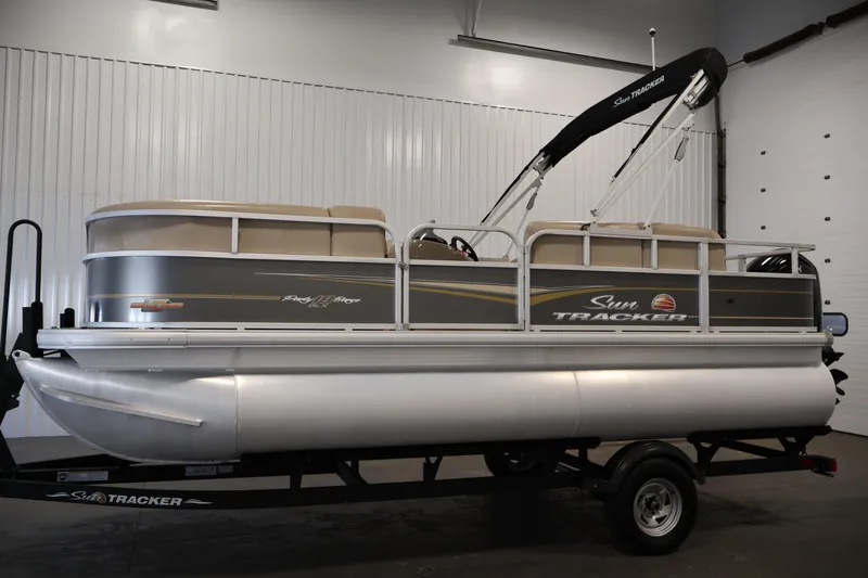 Slide: The Image of 2023 Sun Tracker Party Barge 18 DLX pontoon boat in showroom. - 8
