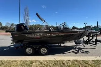 Slide: The Image of 2023 Tracker Targa V-19 WT boat on trailer, parked on roadside. - 4