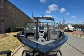 Slide: The Image of 2023 Tracker Targa V-19 WT boat parked outdoors on a sunny day. - 5