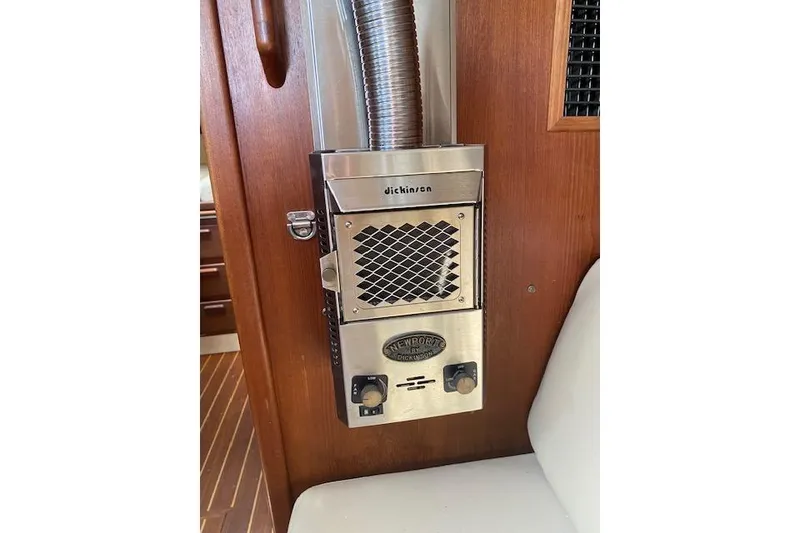 Slide: The Image of Dickinson heater inside 1995 Pacific Seacraft Crealock 34 sailboat cabin. - 14