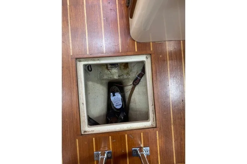 Slide: The Image of 1995 Pacific Seacraft Crealock 34 bilge compartment with wooden flooring. - 24