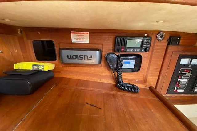 Slide: The Image of Navigation equipment inside a 1995 Pacific Seacraft Crealock 34 sailboat cabin. - 27