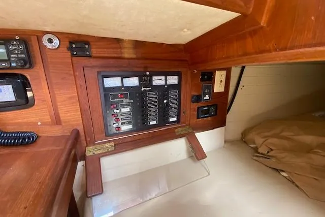 Slide: The Image of Electrical panel inside a 1995 Pacific Seacraft Crealock 34 sailboat cabin. - 28