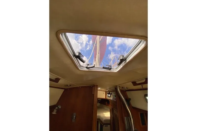 Slide: The Image of Interior view of 1995 Pacific Seacraft Crealock 34 sailboat, looking through hatch at sky. - 30
