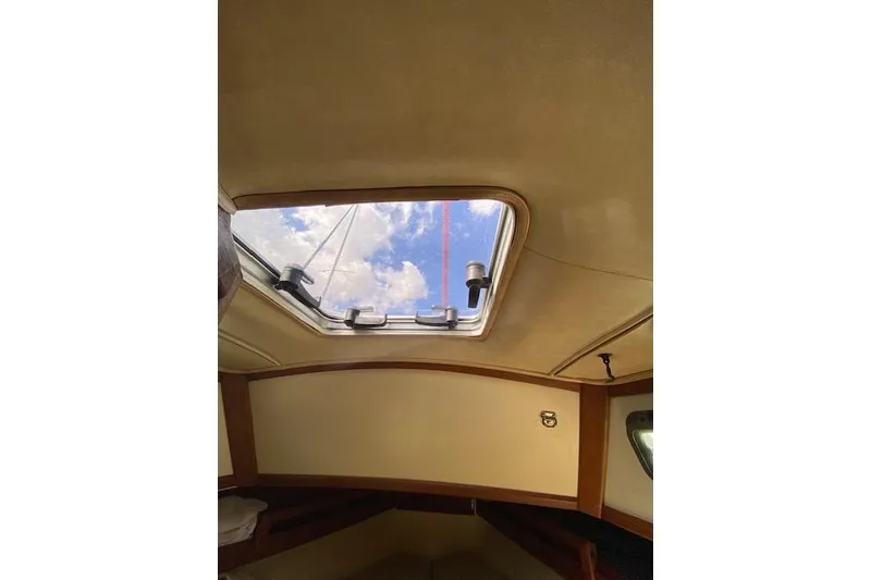 Slide: The Image of Interior view of 1995 Pacific Seacraft Crealock 34 sailboat with skylight and blue sky. - 31