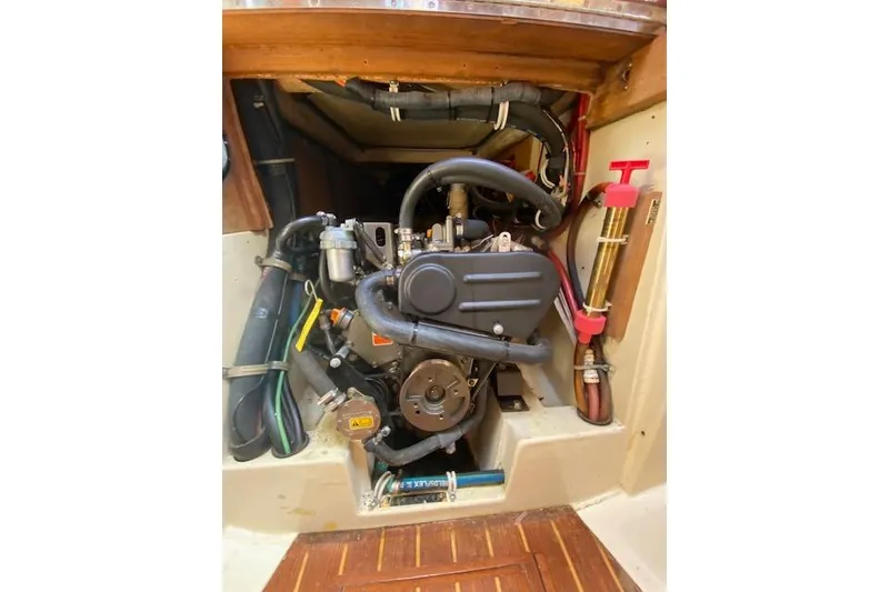 Slide: The Image of Engine compartment of a 1995 Pacific Seacraft Crealock 34 sailboat, showcasing detailed components. - 33
