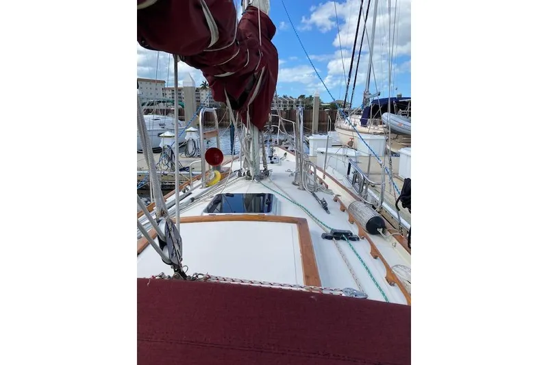 Slide: The Image of 1995 Pacific Seacraft Crealock 34 sailboat deck with rigging and marina view. - 35
