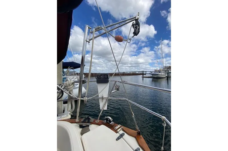 Slide: The Image of Sailboat deck view, Pacific Seacraft Crealock 34, 1995, with marina and cloudy sky. - 8