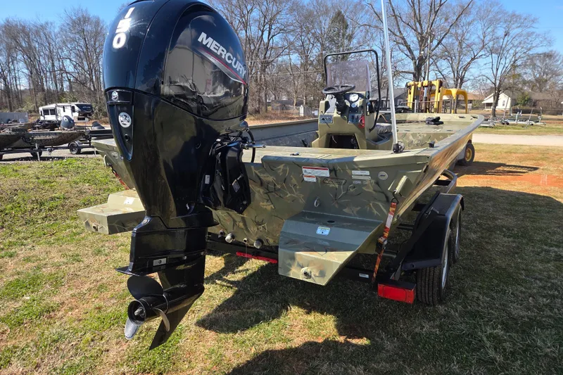 Slide: The Image of 2022 Tracker Grizzly 2072 CC boat with Mercury outboard motor on trailer. - 5