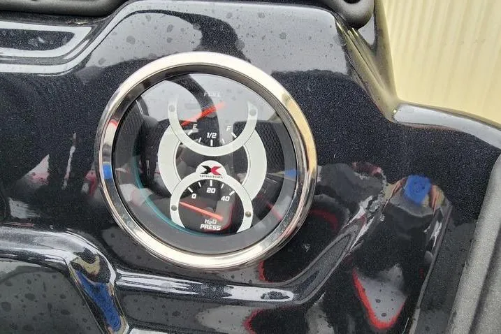 Slide: The Image of Dashboard gauges of 2025 Xpress H20 Bass boat, showing fuel and pressure levels. - 11