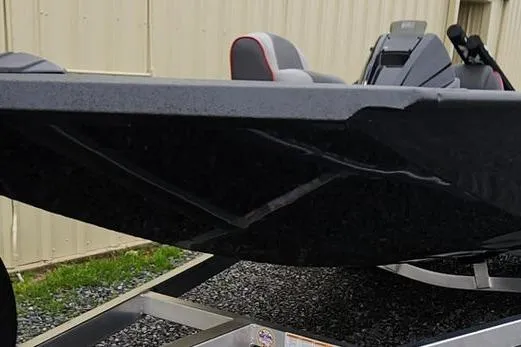 Slide: The Image of 2025 Xpress H20 Bass boat on trailer, close-up view of hull and seating. - 20