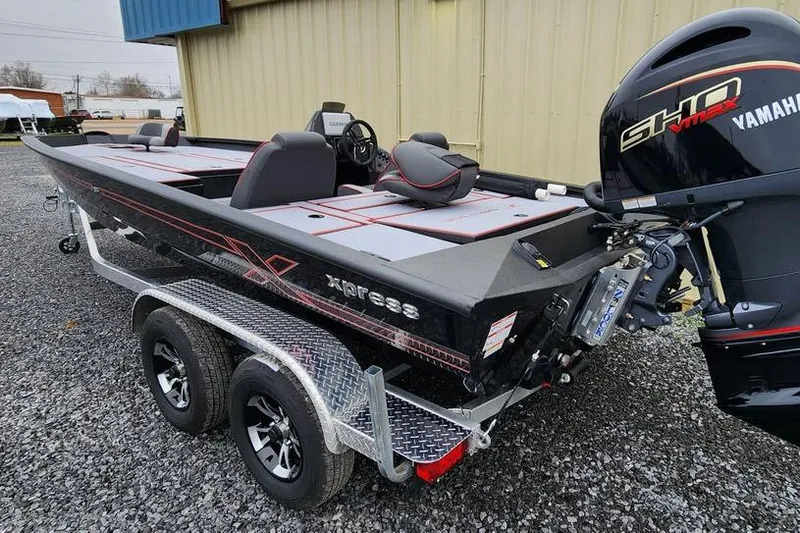 Slide: The Image of 2025 Xpress H20 Bass boat with Yamaha engine on a dual-axle trailer. - 5