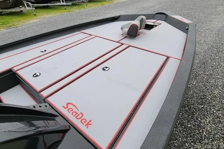 Slide: The Image of 2025 Xpress H20 Bass boat with SeaDek flooring, featuring sleek design and comfortable seating. - 9