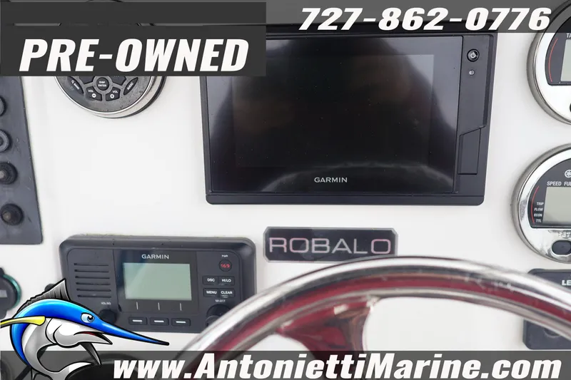 Slide: The Image of Pre-owned 2017 Robalo R200 Center Console dashboard with Garmin electronics. - 13