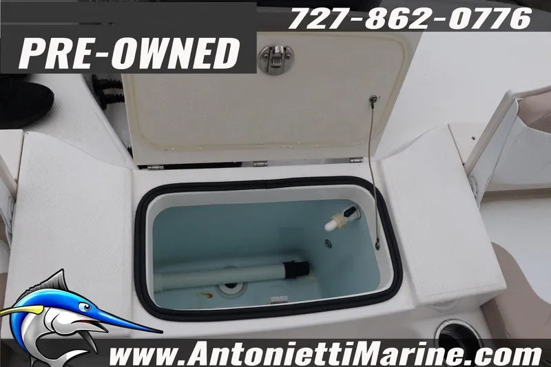Slide: The Image of Pre-owned 2017 Robalo R200 Center Console boat with open storage compartment. - 24