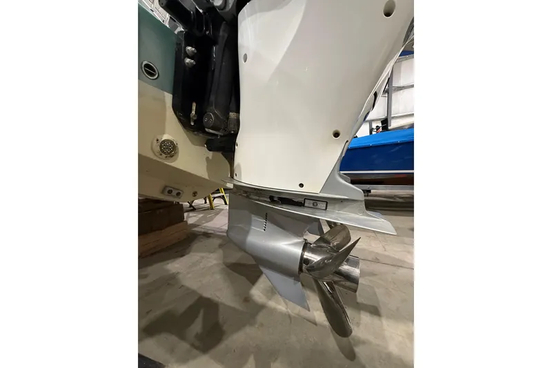 Slide: The Image of 2021 Mag Bay 33 CC boat with Mercury engines in a storage facility. - 16