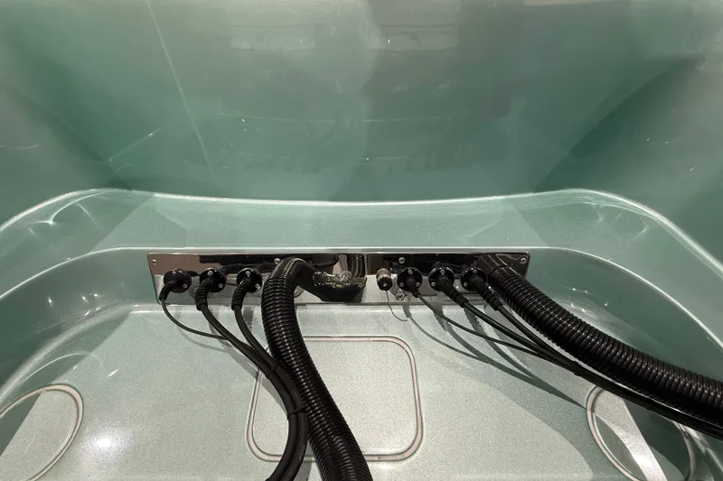 Slide: The Image of 2021 Mag Bay 33 CC boat in a storage facility, featuring a sleek design. - 19