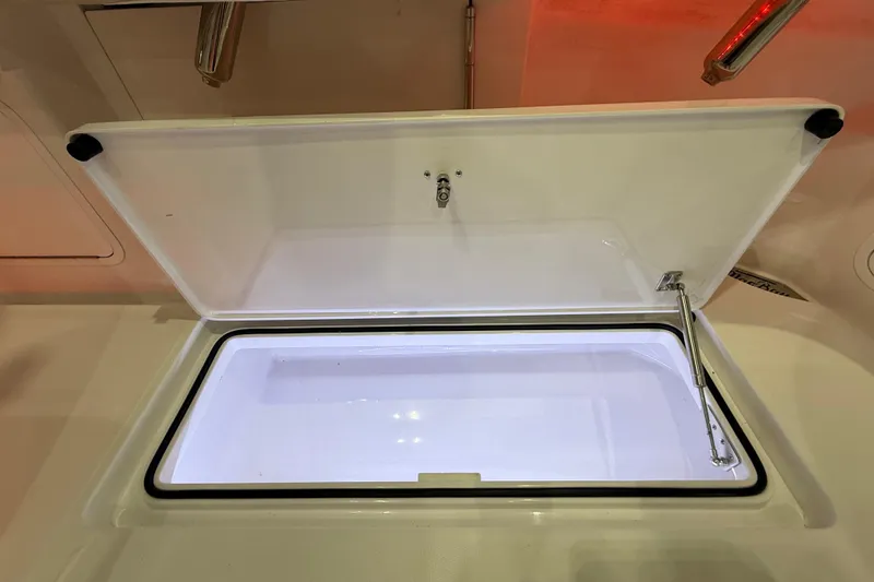 Slide: The Image of 2021 Mag Bay 33 CC boat with Mercury engine in storage facility. - 22