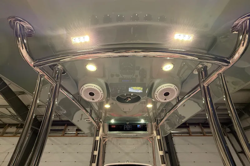 Slide: The Image of 2021 Mag Bay 33 CC boat engine close-up in a workshop setting. - 23