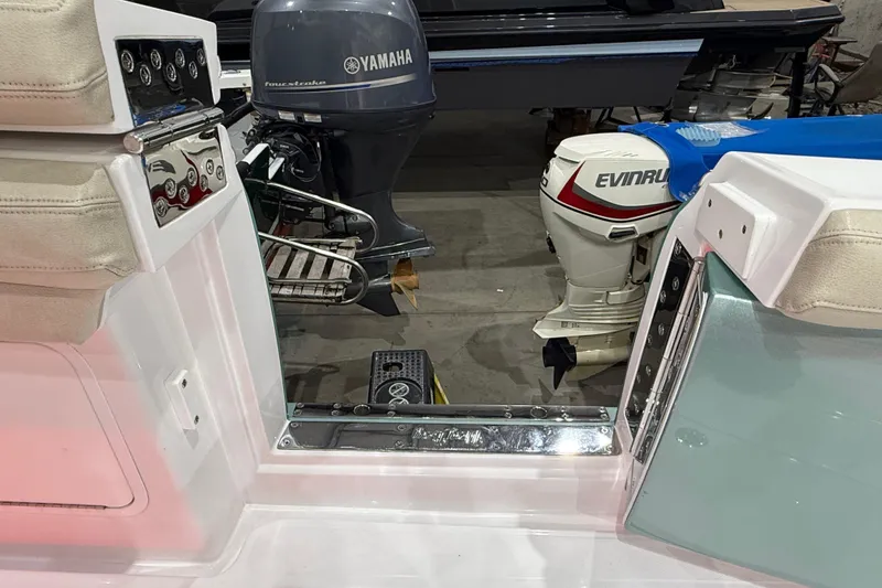 Slide: The Image of 2021 Mag Bay 33 CC with dual Mercury outboard engines in a showroom. - 26