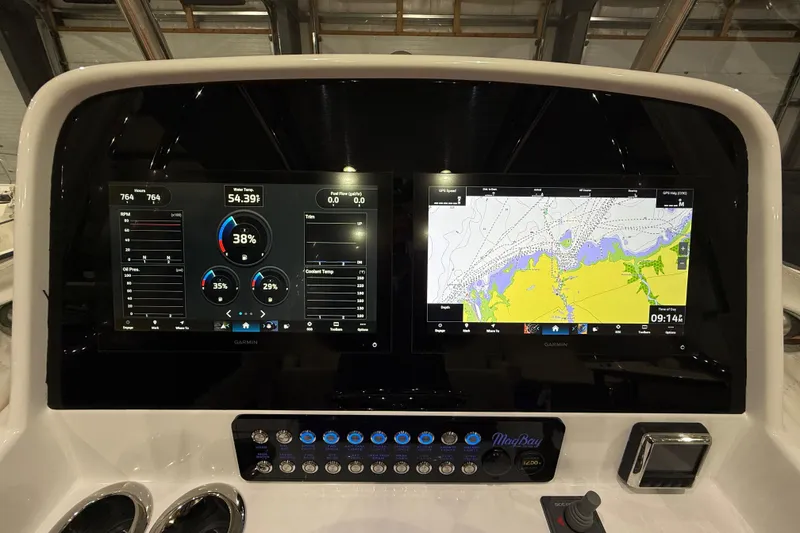 Slide: The Image of 2021 Mag Bay 33 CC boat interior with Yamaha and Evinrude outboard motors. - 34
