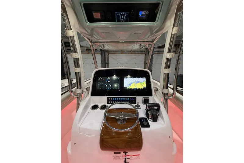 Slide: The Image of 2021 Mag Bay 33 CC boat seats with logo, featuring luxurious white upholstery. - 38