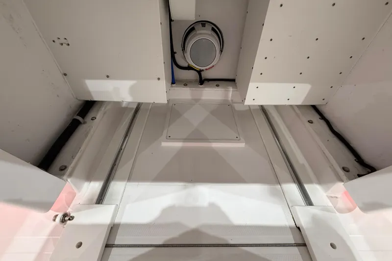 Slide: The Image of 2021 Mag Bay 33 CC dashboard with dual Garmin displays and navigation controls. - 42