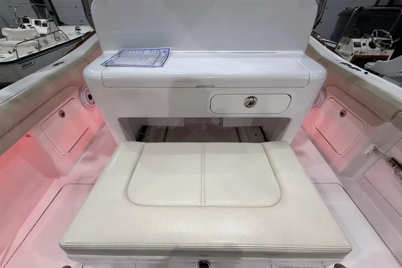 Slide: The Image of 2021 Mag Bay 33 CC dashboard display showing engine metrics and water temperature. - 43