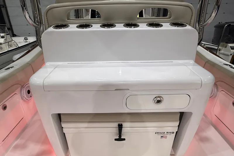 Slide: The Image of 2021 Mag Bay 33 CC boat helm with advanced navigation displays and controls. - 47