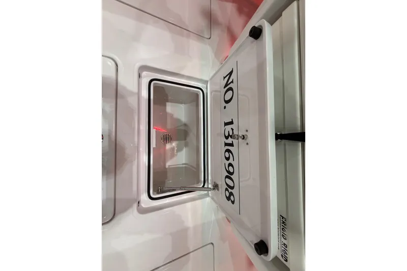 Slide: The Image of 2021 Mag Bay 33 CC boat interior with illuminated console and navigation screens. - 48