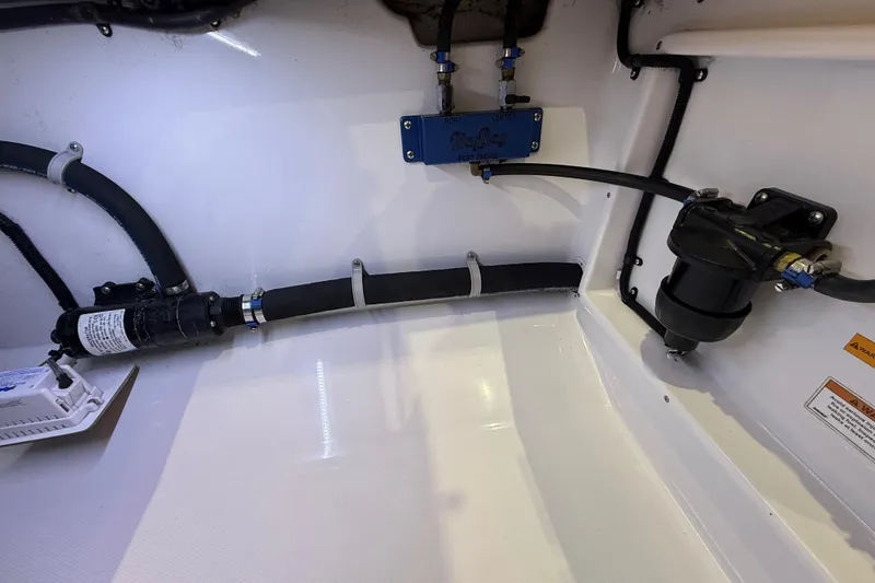 Slide: The Image of 2021 Mag Bay 33 CC boat interior with illuminated console and navigation display. - 49