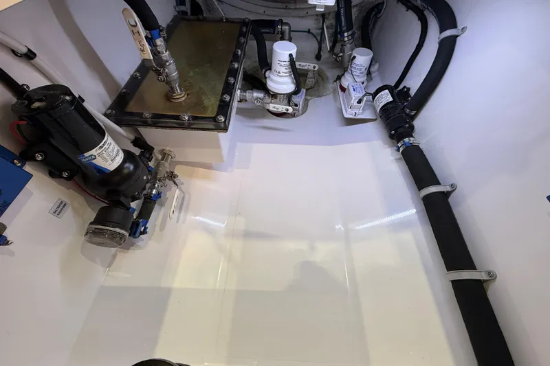 Slide: The Image of Interior view of 2021 Mag Bay 33 CC boat, showcasing storage compartment details. - 51