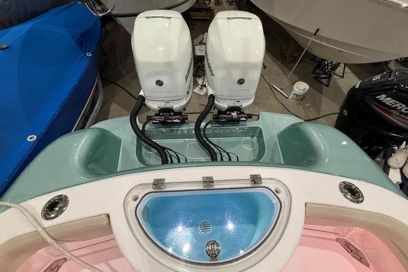 Slide: The Image of Open storage compartment on 2021 Mag Bay 33 CC boat, showcasing interior space. - 53