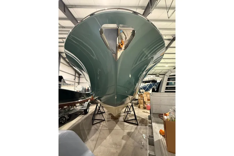 Slide: The Image of 2021 Mag Bay 33 CC boat docked at marina during sunset. - 6